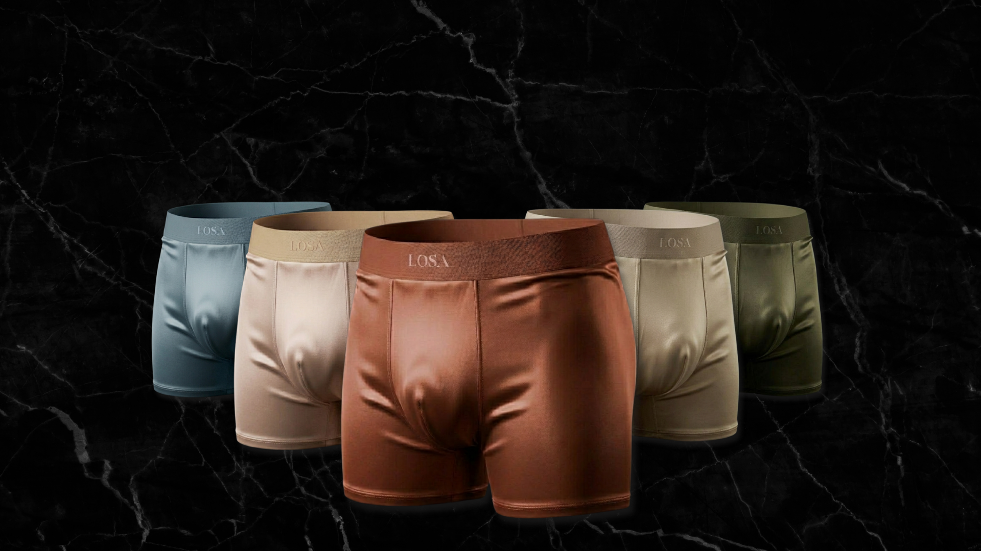  Boxer da uomo LOSA in tessuto CoolSilk effetto seta, cinque tonalità: terracotta, slate blue, champagne, champagne rosé e verde oliva, su sfondo marmo scuro